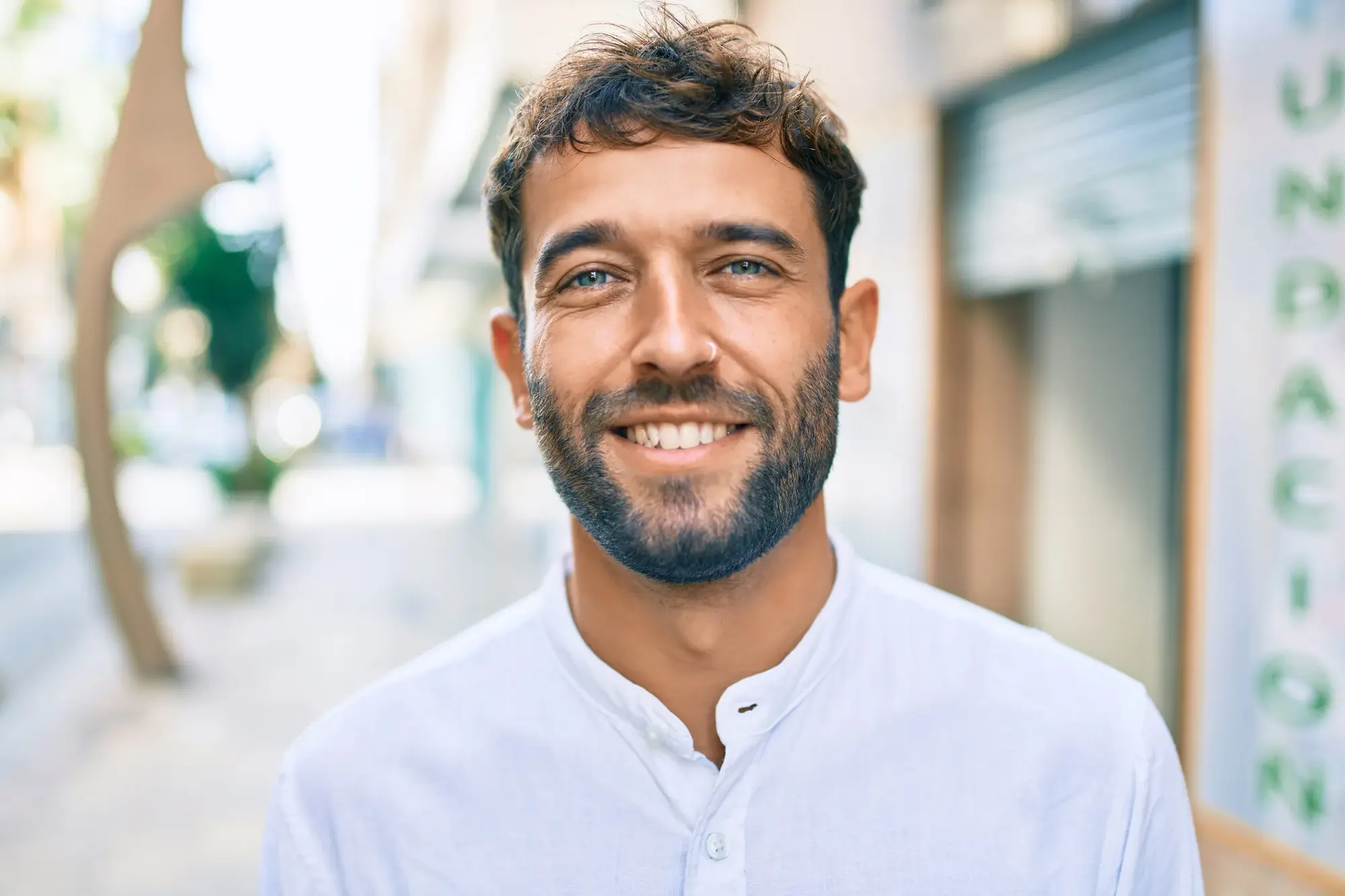 Smiling man representing patients navigating financing at Compass Dental
