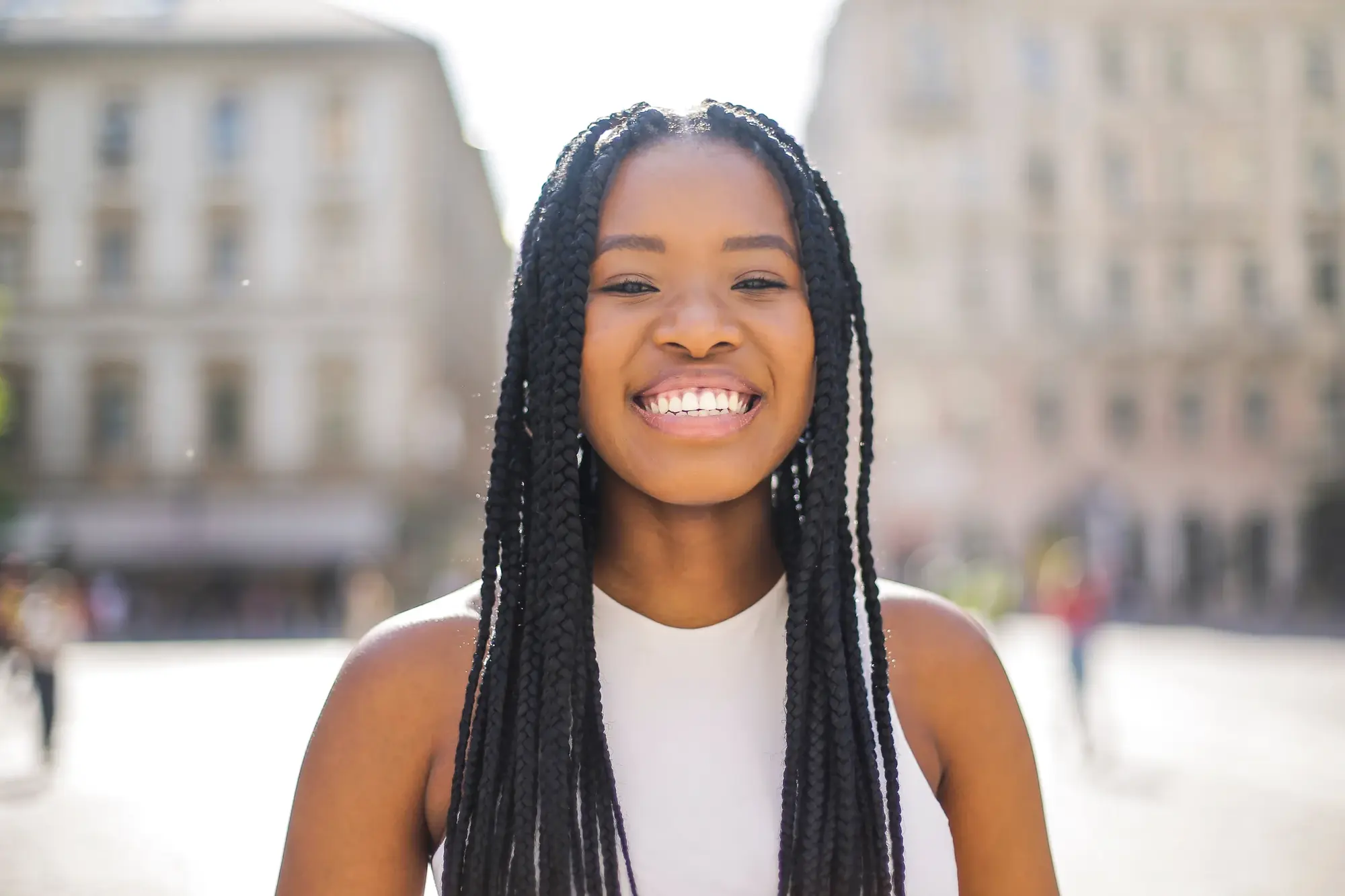 Smiling woman representing new patients at Compass Dental